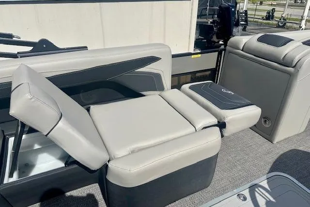 Slide: The Image of 2026 Barletta C22M boat interior with adjustable gray seating and storage compartments. - 11