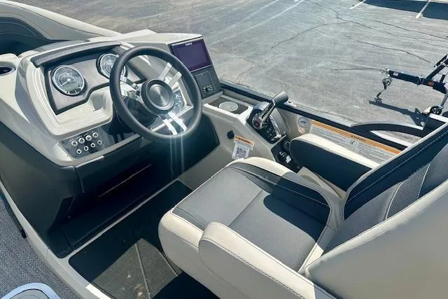 Slide: The Image of 2026 Barletta C22M boat interior with modern dashboard and steering wheel. - 13