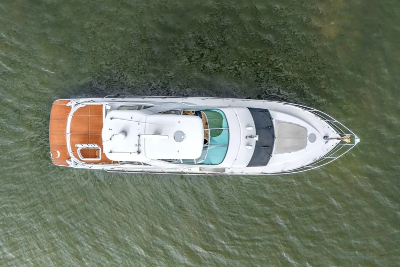 Slide: The Image of Aerial view of 2004 Carver 570 Voyager Pilothouse yacht on water. - 10
