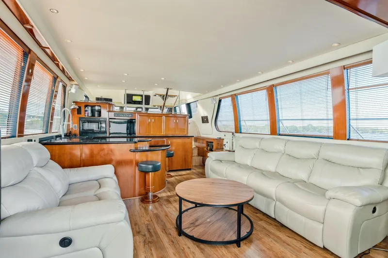 Slide: The Image of Luxurious interior of 2004 Carver 570 Voyager Pilothouse with leather seating and modern kitchen. - 14