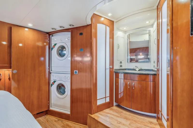 Slide: The Image of Interior of 2004 Carver 570 Voyager Pilothouse with washer, dryer, and vanity area. - 34