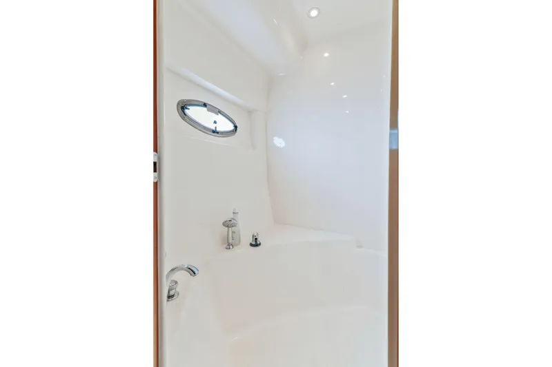 Slide: The Image of Bathroom interior of 2004 Carver 570 Voyager Pilothouse yacht with porthole window. - 35