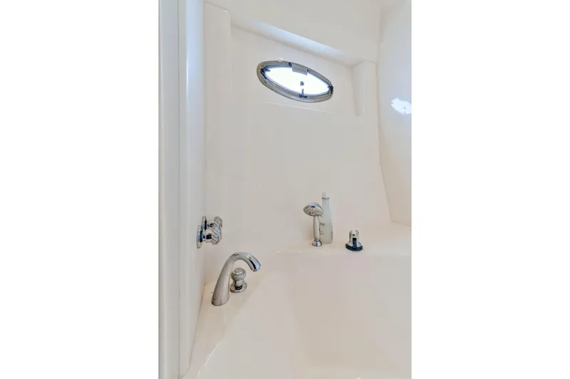 Slide: The Image of Bathroom fixtures in 2004 Carver 570 Voyager Pilothouse yacht, featuring a sleek design. - 36