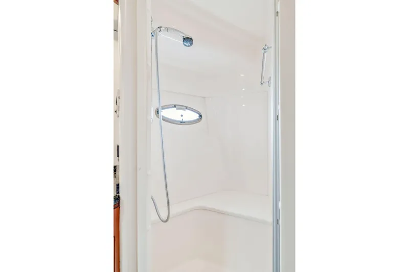 Slide: The Image of Shower area in 2004 Carver 570 Voyager Pilothouse yacht, featuring sleek design and modern fixtures. - 42