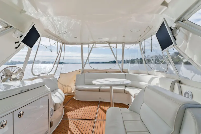 Slide: The Image of Luxurious interior of 2004 Carver 570 Voyager Pilothouse yacht with elegant seating and scenic views. - 47
