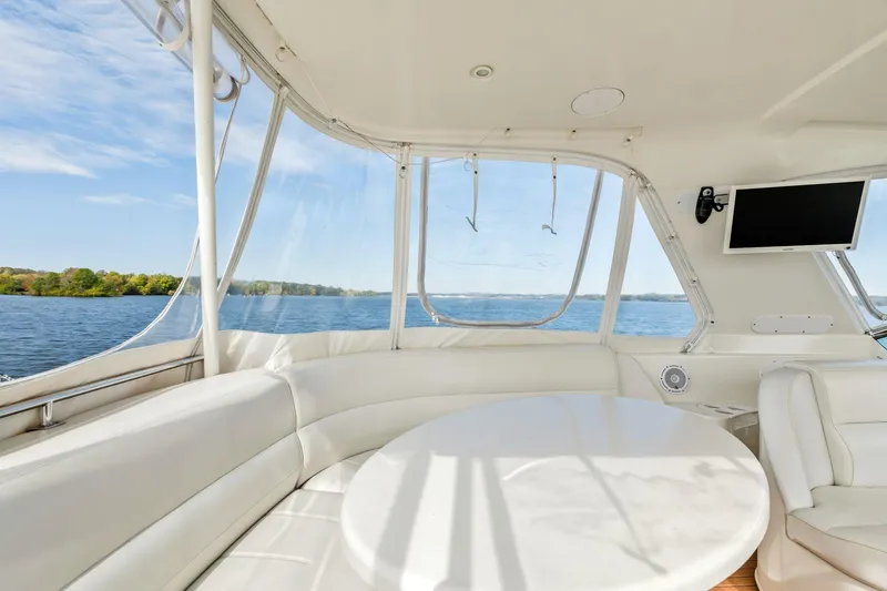 Slide: The Image of Luxurious interior of 2004 Carver 570 Voyager Pilothouse yacht with scenic water view. - 50