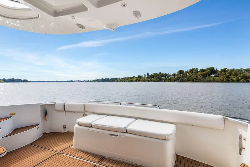 Slide: The Image of 2004 Carver 570 Voyager Pilothouse yacht deck with scenic water view. - 56