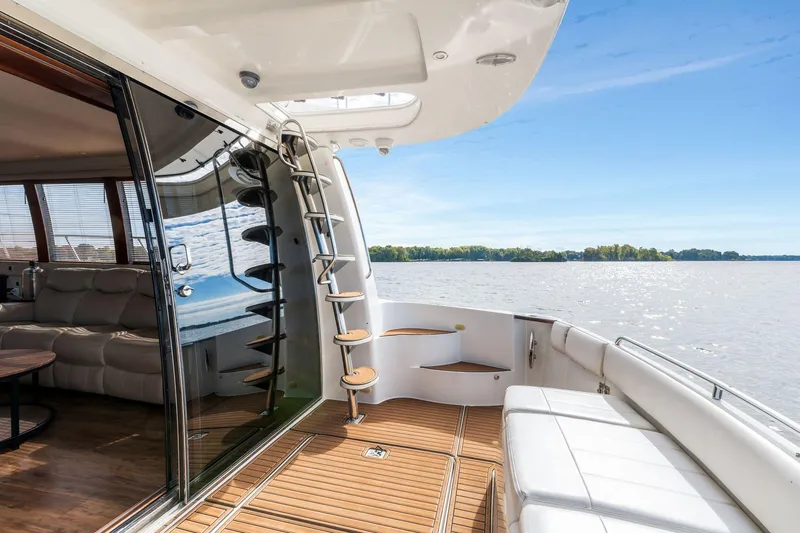 Slide: The Image of Luxurious 2004 Carver 570 Voyager Pilothouse yacht interior with lake view. - 57