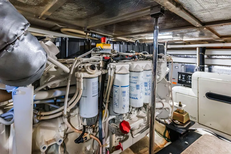 Slide: The Image of Engine room of 2004 Carver 570 Voyager Pilothouse with Volvo components and wiring. - 68