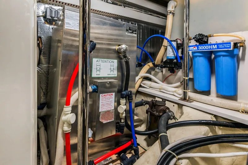 Slide: The Image of Engine room of 2004 Carver 570 Voyager Pilothouse with water filtration system. - 71