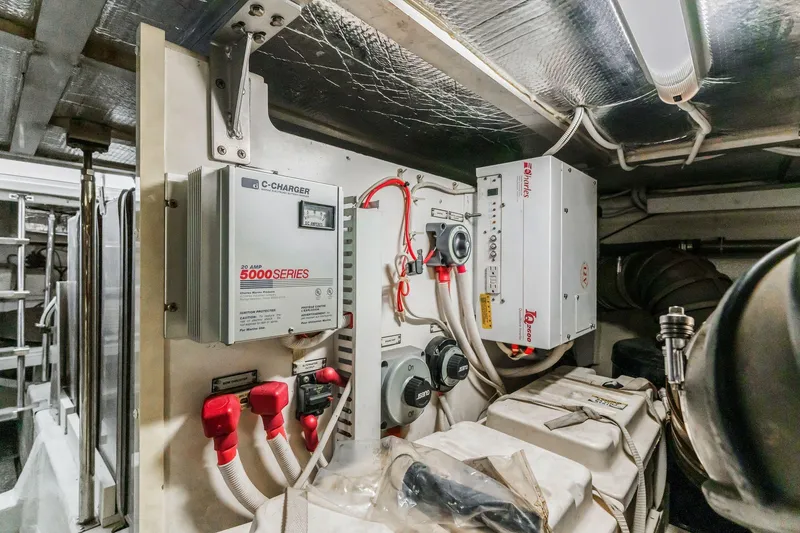 Slide: The Image of Engine room of 2004 Carver 570 Voyager Pilothouse with electrical systems and equipment. - 74