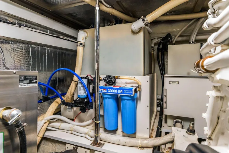 Slide: The Image of Engine room of 2004 Carver 570 Voyager Pilothouse with water filtration system. - 75