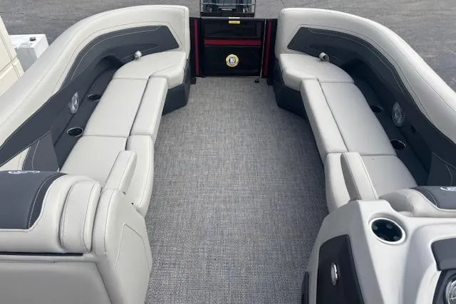 Slide: The Image of 2026 Barletta C24Q boat interior with gray seating and carpeted flooring. - 6