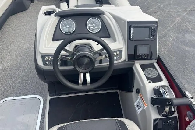 Slide: The Image of Steering console of 2026 Barletta C24Q boat with modern controls and navigation system. - 8