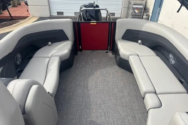 Slide: The Image of 2026 Barletta C24Q pontoon boat interior with gray seating and carpeted floor. - 9