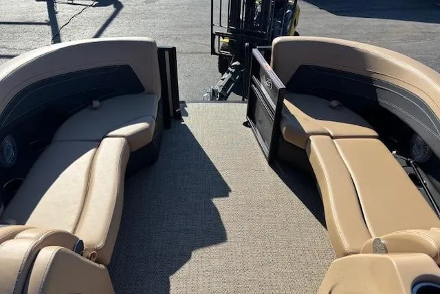 Slide: The Image of 2026 Barletta C24UE pontoon boat interior with beige seating and carpeted deck. - 4