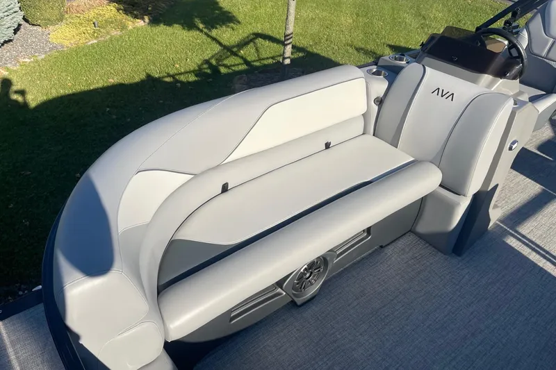 Slide: The Image of 2025 Avalon Venture 2585 VRB boat interior with gray seating and storage compartment. - 11