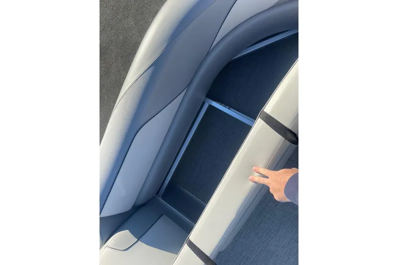 Slide: The Image of 2025 Avalon Venture 2585 VRB boat interior with sleek gray seating and cup holders. - 12