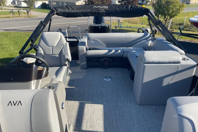 Slide: The Image of Luxurious seating on 2025 Avalon Venture 2585 VRB pontoon boat, featuring sleek gray upholstery. - 16