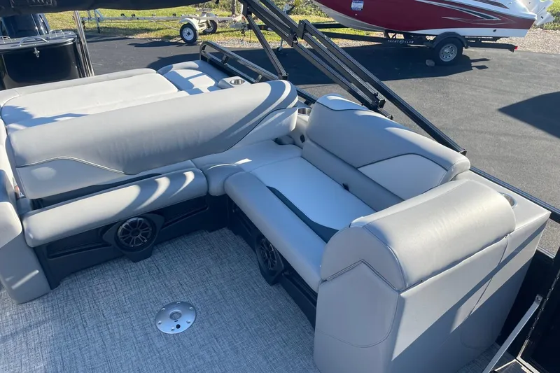 Slide: The Image of 2025 Avalon Venture 2585 VRB boat interior with steering console and seating. - 17