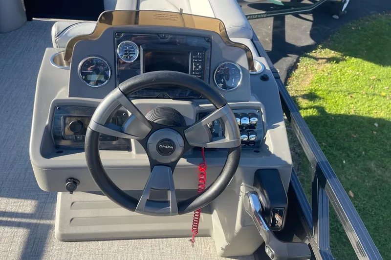 Slide: The Image of 2025 Avalon Venture 2585 VRB boat dashboard with Fusion audio system. - 21