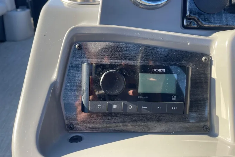 Slide: The Image of 2025 Avalon Venture 2585 VRB dashboard with RPM gauge and control panel. - 22