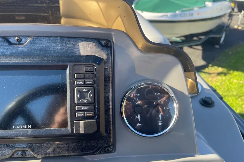 Slide: The Image of Control panel of 2025 Avalon Venture 2585 VRB boat with ignition and switches. - 24
