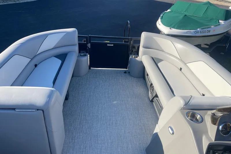 Slide: The Image of Luxurious seating on 2025 Avalon Venture 2585 VRB pontoon boat, featuring cup holders and sleek design. - 29