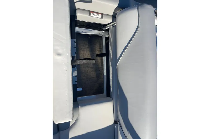 Slide: The Image of 2025 Avalon Venture 2585 VRB boat interior with cushioned seating and cup holders. - 32