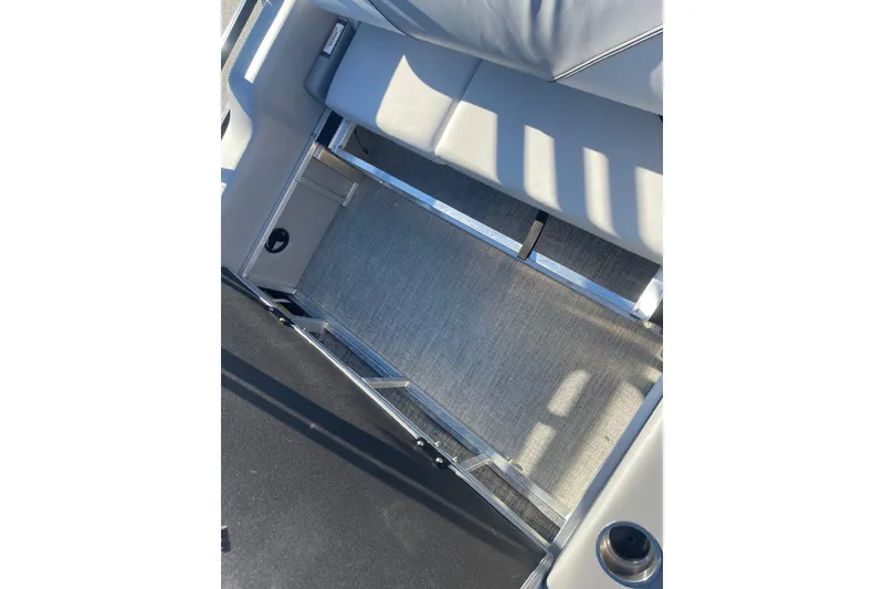 Slide: The Image of 2025 Avalon Venture 2585 VRB boat seat with sleek white upholstery and cup holder. - 34