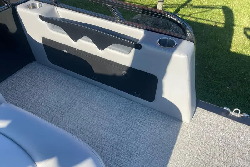 Slide: The Image of 2025 Avalon Venture 2585 VRB interior storage compartment with gray flooring and metal frame. - 40