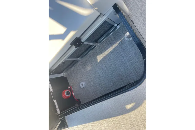 Slide: The Image of 2025 Avalon Venture 2585 VRB boat interior with gray cushioned seating. - 41