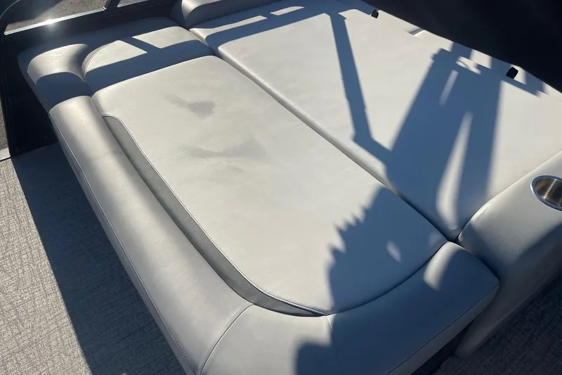 Slide: The Image of 2025 Avalon Venture 2585 VRB pontoon boat interior with modern seating and steering console. - 42