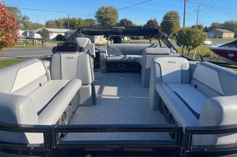 Slide: The Image of 2025 Avalon Venture 2585 VRB pontoon boat with sleek seating and modern design. - 7