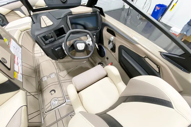 Slide: The Image of Interior of 2025 Centurion Fe22 boat with modern dashboard and steering wheel. - 11