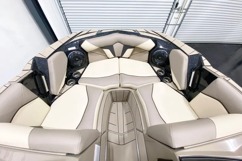 Slide: The Image of Luxurious interior of 2025 Centurion Fe22 boat with beige seating and built-in speakers. - 13
