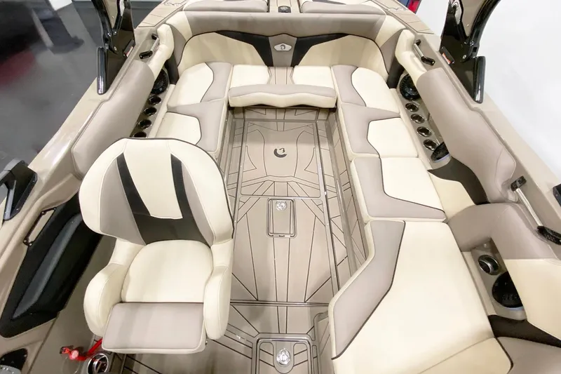 Slide: The Image of 2025 Centurion Fe22 boat interior with beige and black seating, modern design. - 8