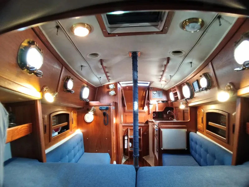 Slide: The Image of Interior of a 1988 Pacific Seacraft Dana 24 yacht with wooden finish. - 19