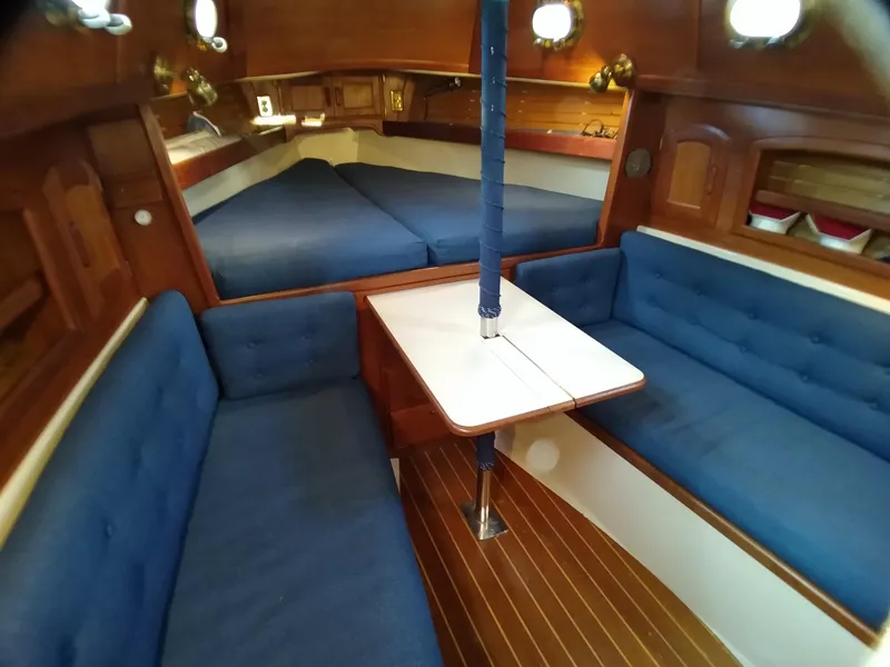Slide: The Image of Interior of 1988 Pacific Seacraft Dana 24 sailboat with blue seating. - 21