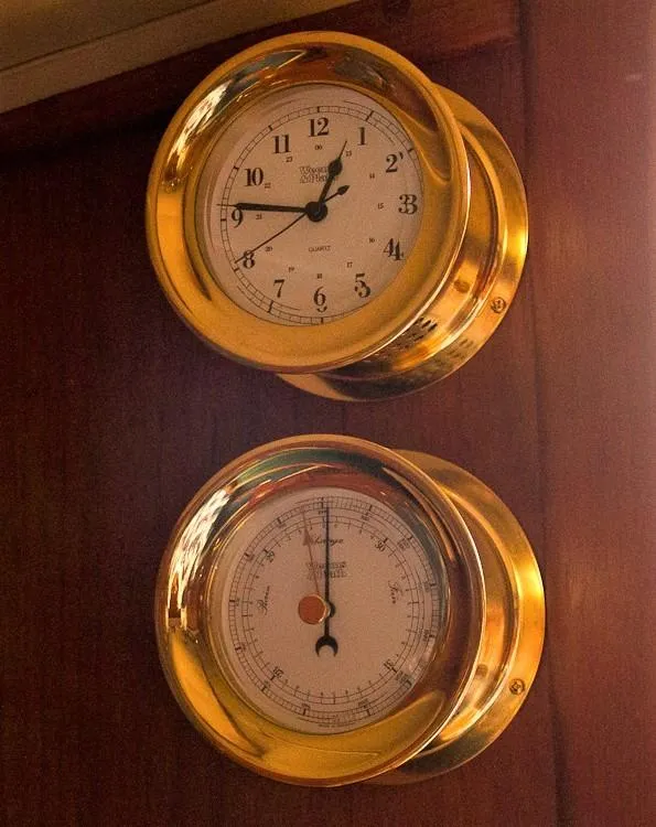 Slide: The Image of Brass clock and barometer on Pacific Seacraft Dana 24, year 1988. - 32