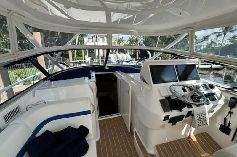 Slide: The Image of 2019 Intrepid 430 Sport Yacht cockpit with modern controls and spacious seating. - 1