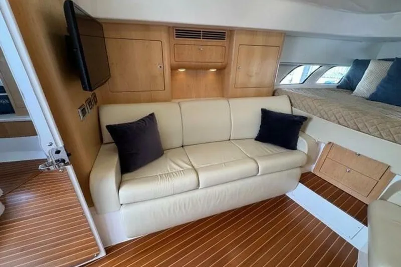 Slide: The Image of Luxurious interior of 2019 Intrepid 430 Sport Yacht with sofa and bed. - 11
