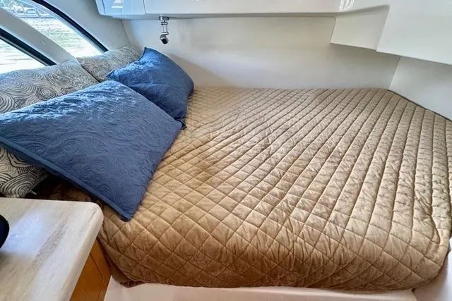 Slide: The Image of Luxurious cabin interior of 2019 Intrepid 430 Sport Yacht with cozy bedding. - 13