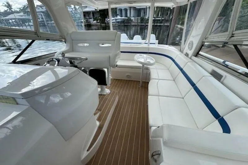 Slide: The Image of Luxurious interior of 2019 Intrepid 430 Sport Yacht with white seating and wood flooring. - 2