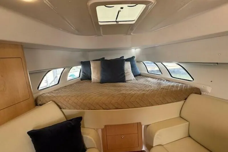 Slide: The Image of Interior cabin of 2019 Intrepid 430 Sport Yacht with cozy bed and seating area. - 3
