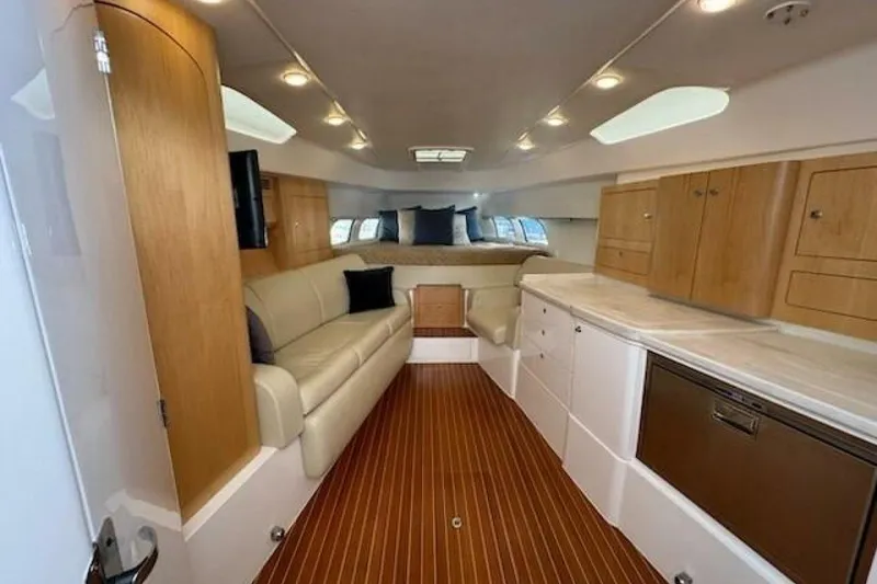 Slide: The Image of Luxurious interior of 2019 Intrepid 430 Sport Yacht with wood accents and modern amenities. - 4