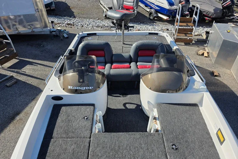 Slide: The Image of 1997 Ranger 462VS boat interior with dual consoles and seating. - 11