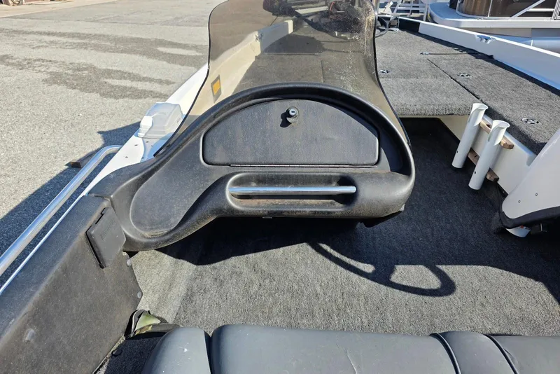 Slide: The Image of 1997 Ranger 462VS boat interior with dashboard and seating area. - 14