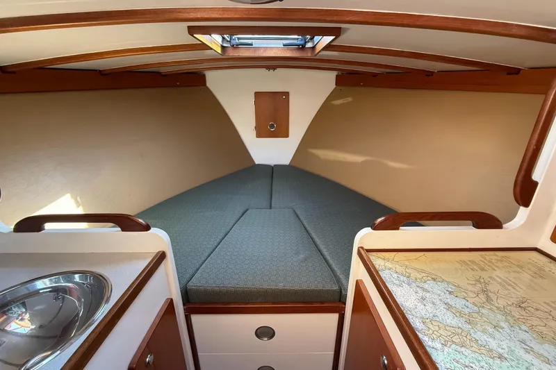 Slide: The Image of Cozy cabin interior of 2013 Black Horse 29 boat with map and sink. - 9