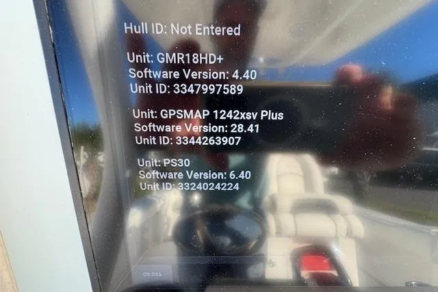 Slide: The Image of Display screen showing software versions and unit IDs for marine electronics on a 2015 Tidewater 280 CC Adventure. - 16